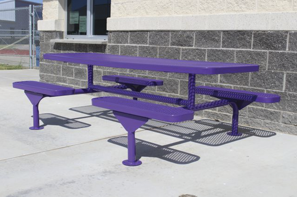 Purple thermoplastic expanded metal picnic table with surface mount frame installed at a commercial school outdoor seating area